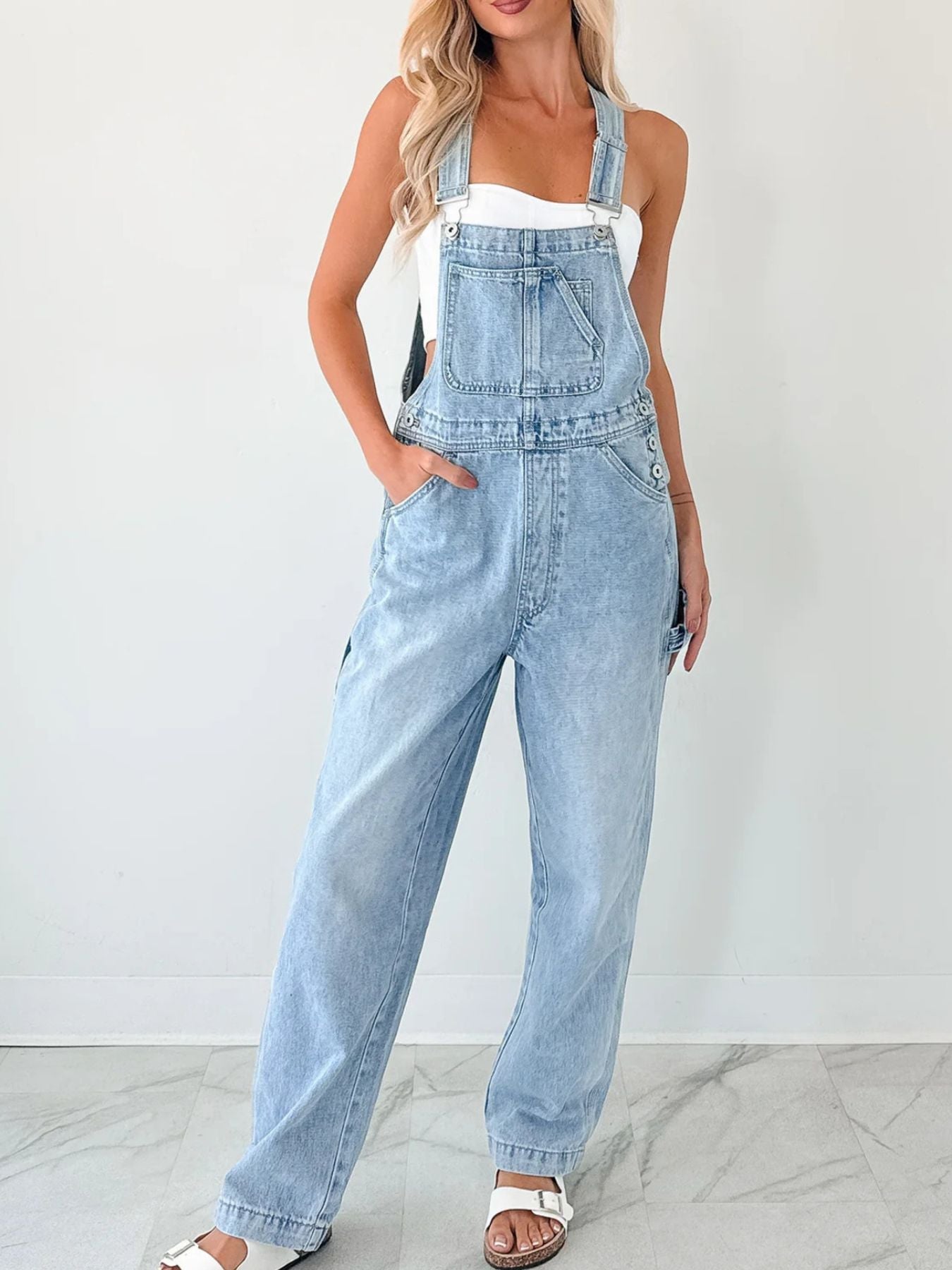 Women's relaxed fit wide strap denim overalls by Trendsi, casual and comfortable jumpsuit with loose fit and wide straps.
