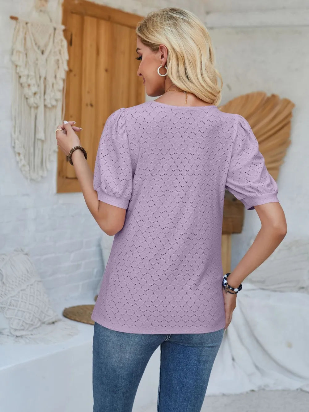 Asymmetrical neck short sleeve T-shirt by Plush Fashion Hub featuring eyelet details and a stylish, modern design.