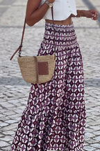 Plush Fashion Hub geometric print smocked waist maxi dress with flowing fabric and stylish design.