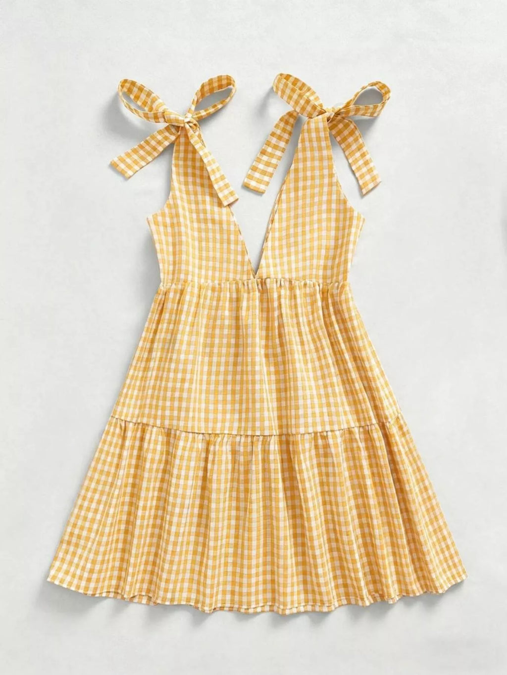 Gingham tie-shoulder mini dress by Plush Fashion Hub featuring a skirt with a stylish, classic plaid pattern and shoulder ties