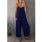 Women's pleated chest cross-strap jumpsuit by Plush Fashion Hub, featuring a stylish design with pleats and cross-straps at the chest.