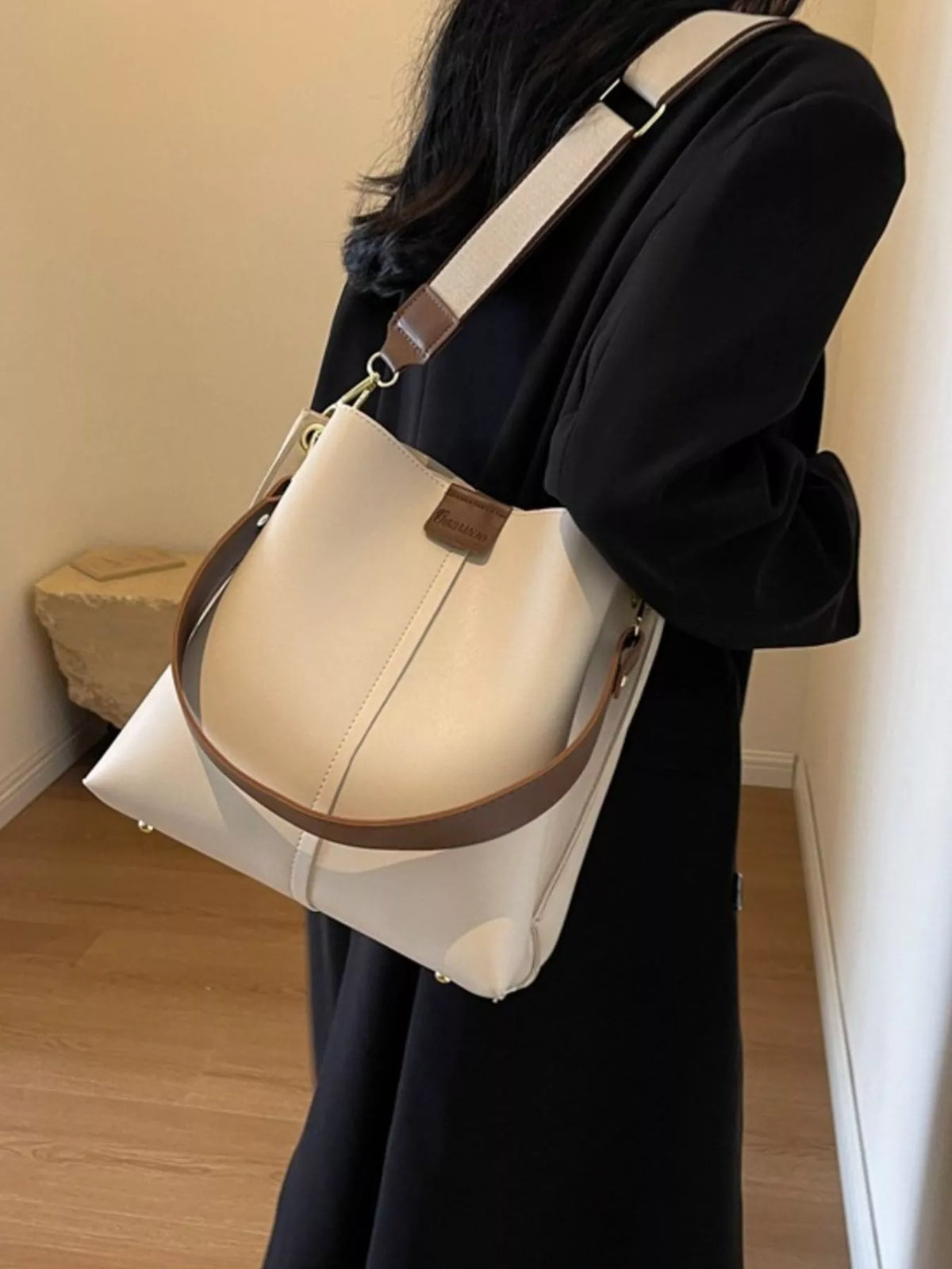 Plush Fashion Hub PU leather crossbody handbag with adjustable strap, stylish design, and compact size for everyday use.