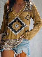 Plus size V-neck T-shirt by Trendsi featuring a geometric print, long sleeves, and a comfortable casual fit.