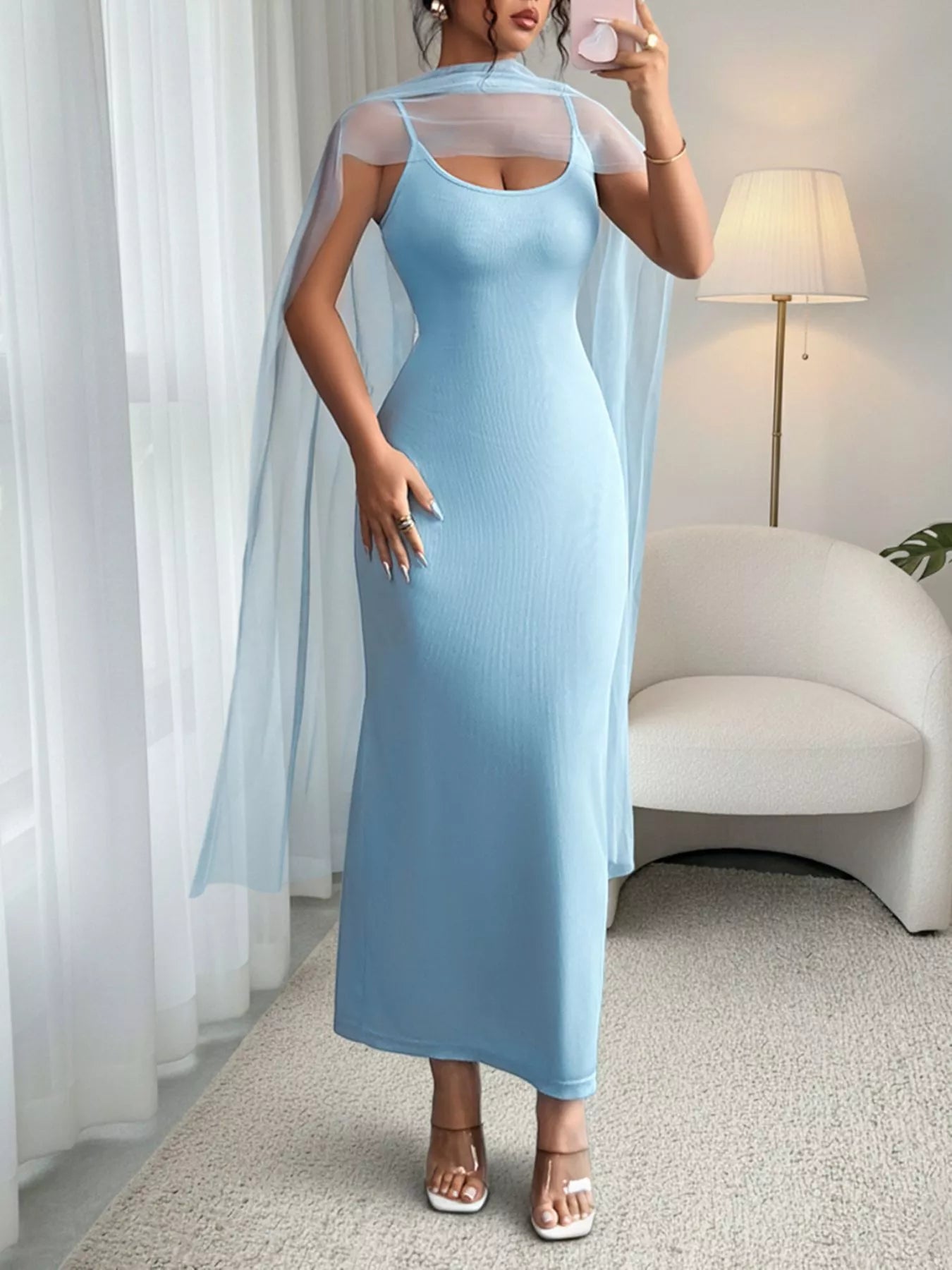 Women's ribbed scoop neck bodycon maxi dress by Trendsi, elegant stretch floor-length dress with a fitted silhouette and sleeveless design.