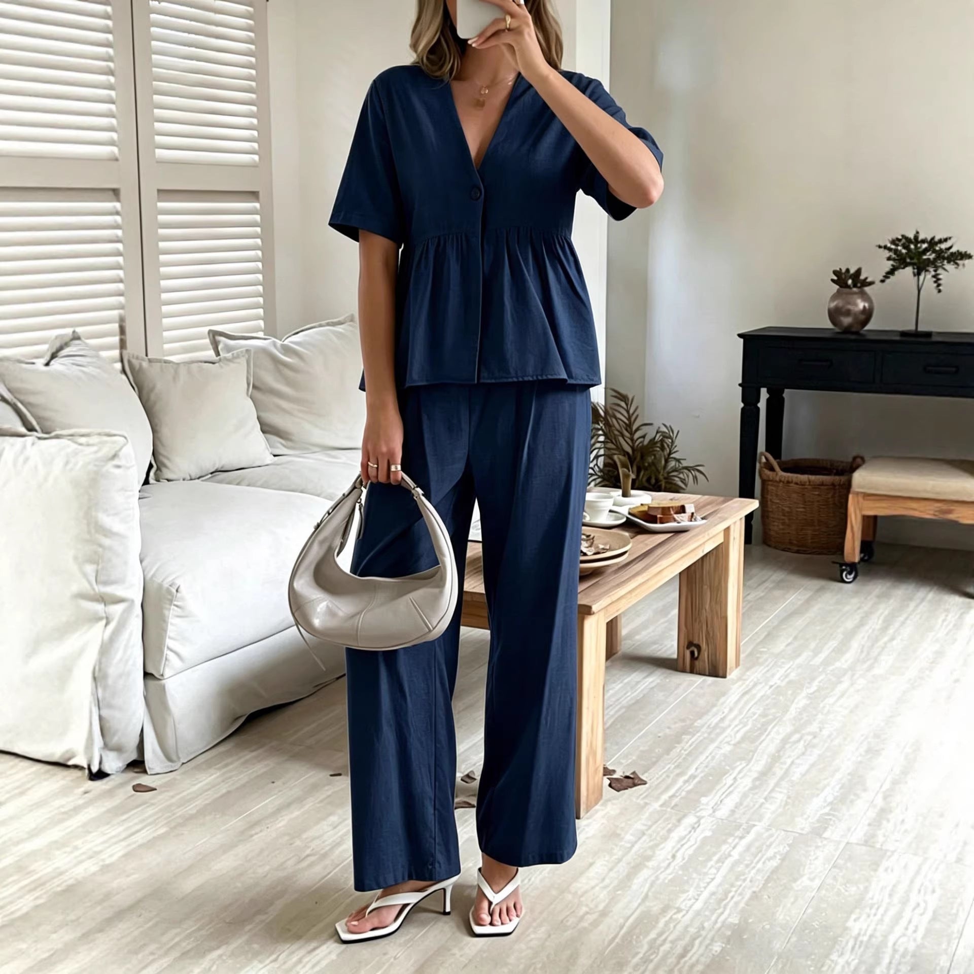 Women's casual FitiqueFit V-neck loose short-sleeve top and wide-leg pants set displayed on a model.