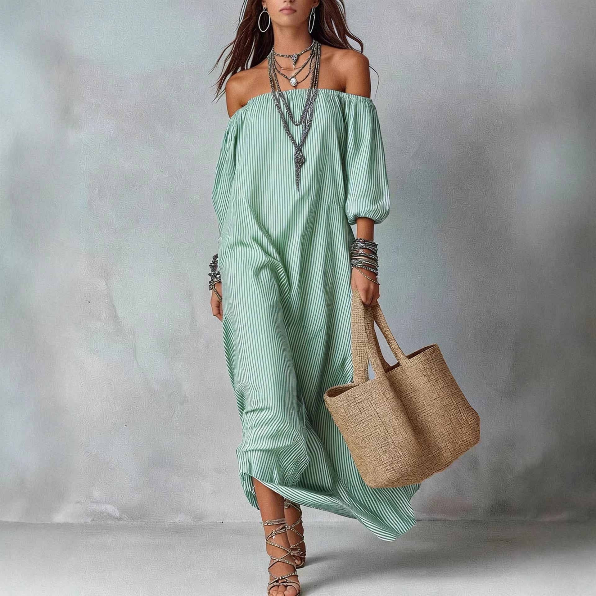 Women's striped loose-fit flared maxi dress by FitiqueFit, featuring a relaxed fit and bold stripe pattern perfect for holidays.