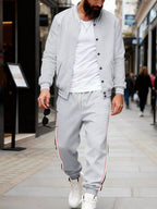 Men's full size striped snap-down top and pants set by Trendsi, plus size, featuring a stylish coordinated outfit with bold stripes.