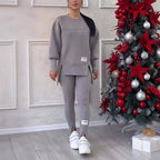 Women's solid color 2-piece casualwear set by Plush Fashion Hub, featuring a matching top and pants on a neutral background.
