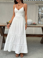 Women's V-neck tiered maxi dress with lace detail by Plush Fashion Hub, flowing fabric and elegant design.