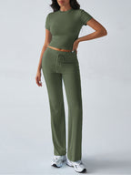 FitiqueFit crew neck short sleeve top and full-length pants set in solid color, displayed in a versatile two-piece outfit.