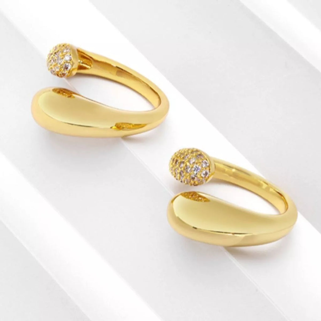 18K gold-plated open ring with sleek design, showcasing a shiny, smooth finish on a white background.