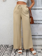 Women's high-waisted wide-leg drawstring pants in soft, breathable viscose fabric, featuring relaxed fit and stylish design.