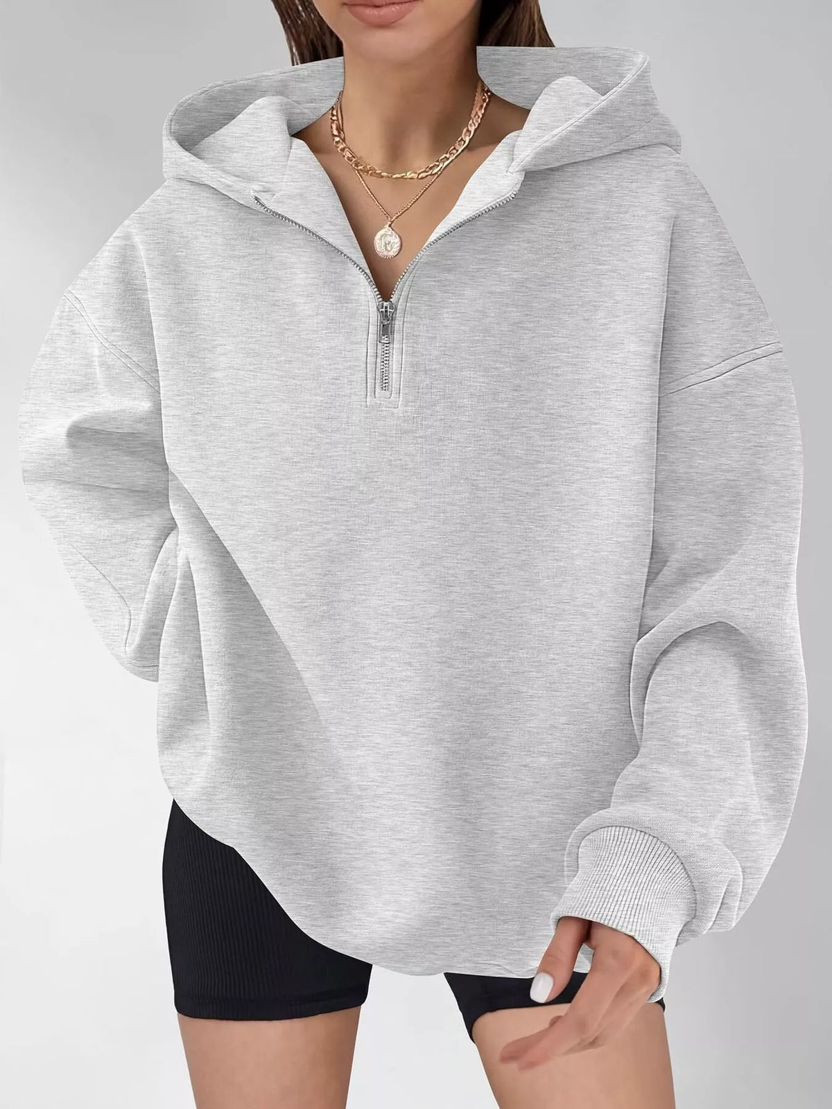 Oversized quarter-zip hoodie from Trendsi, soft cotton blend tops in a relaxed fit with a high collar and front zipper.
