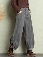 Plush Fashion Hub corduroy wide-leg pants with lace-up detail, street style fashion, showcasing the textured fabric and relaxed fit.