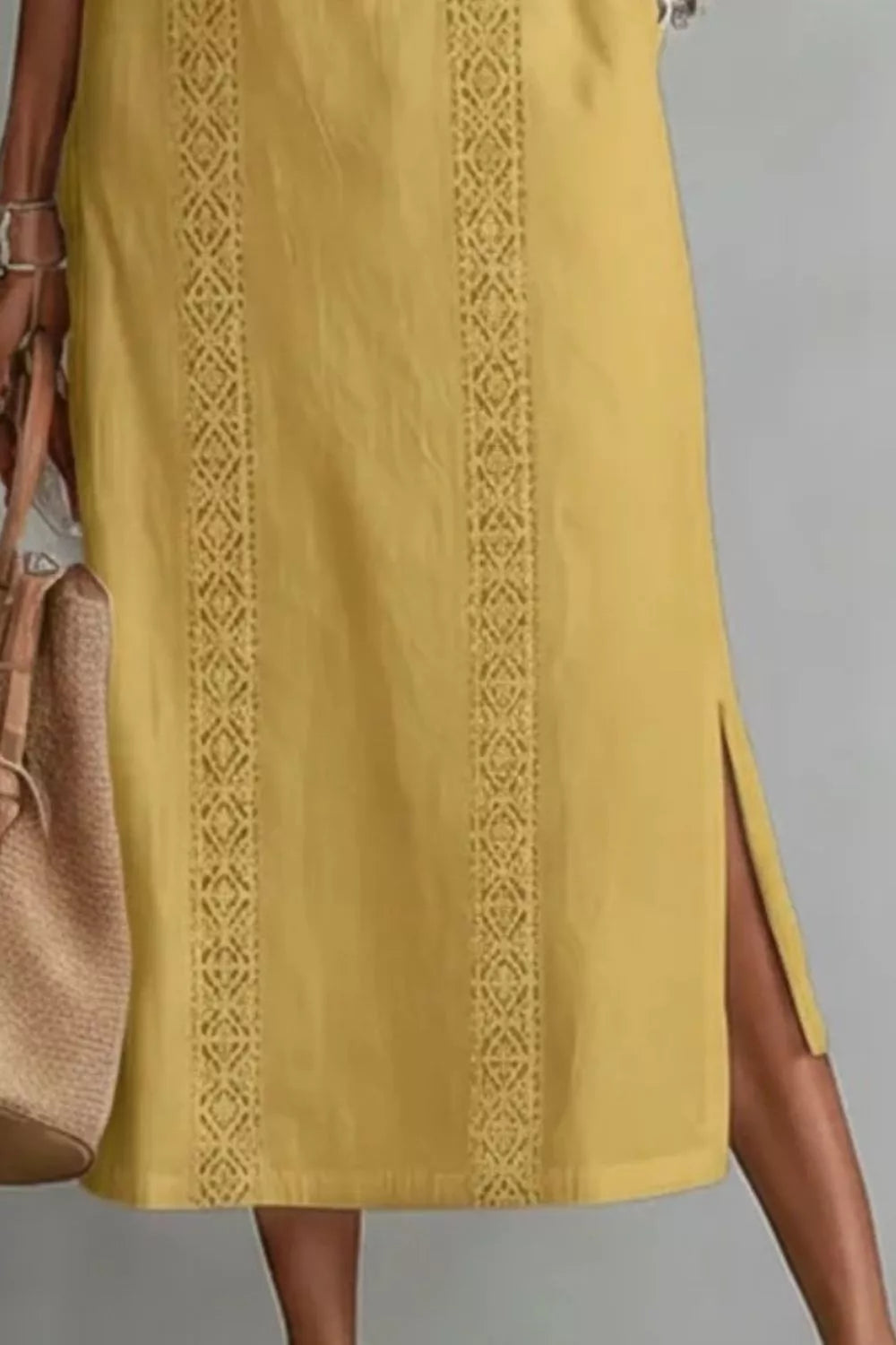 Women's sleeveless maxi dress with side slit and pockets by Plush Fashion Hub, shown in a flowing fabric design.