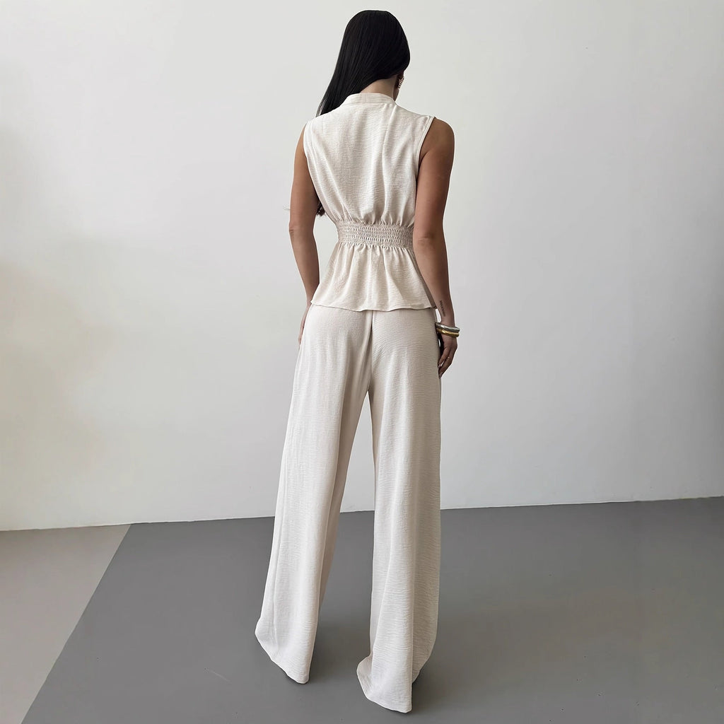 Women's lace-up V-neck vest and pants two-piece set by FitiqueFit, showcasing a stylish, elegant commuter outfit in soft fabric.