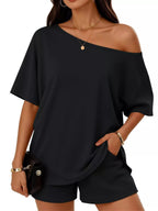 Plus size women's boat neck T-shirt and shorts lounge set by Trendsi, casual comfortable clothing set for relaxed wear.