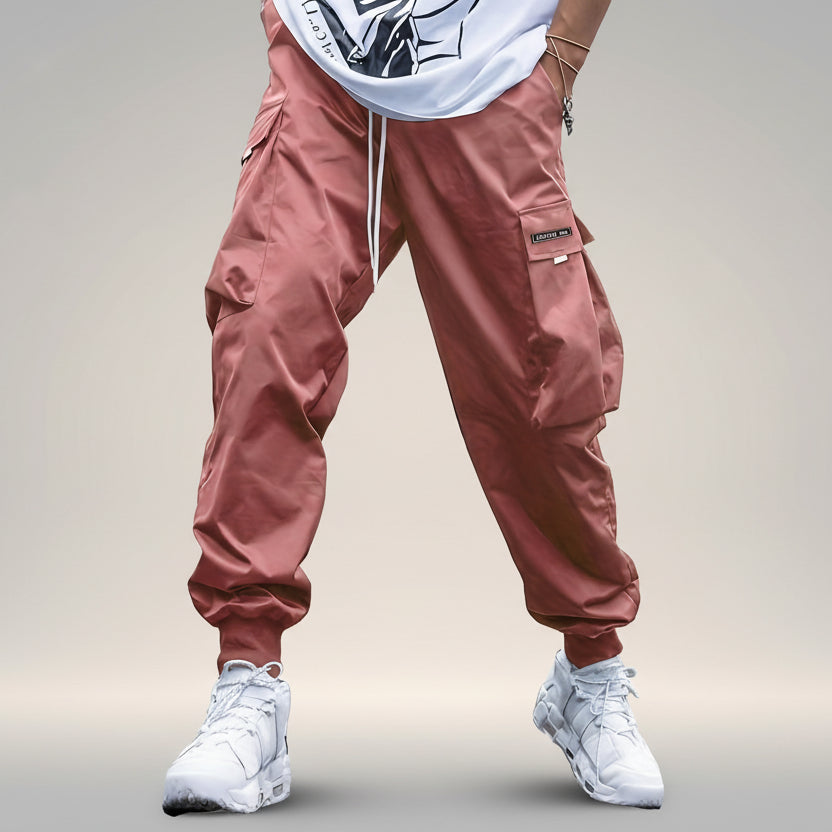 Men’s multi-pocket drawstring cargo pants by Plush Fashion Hub, streetwear style with multiple pockets and adjustable drawstring waist.