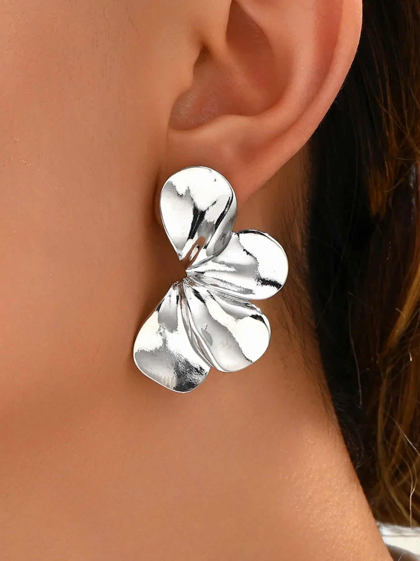 Stainless steel flower earrings by Plush Fashion Hub featuring delicate floral design for stylish accessories.