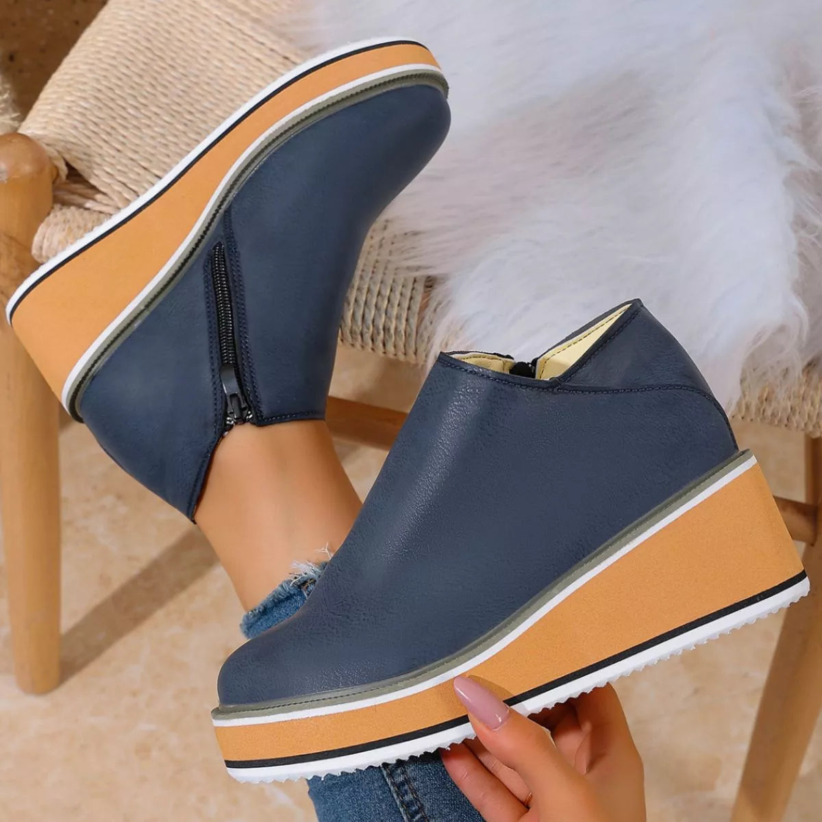 Women's round toe wedge ankle boots by Trendsi featuring a stylish design and ankle-height silhouette.