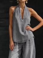 Plus size women's halter neck top and wide-leg pants two-piece set, trendy dress by Trendsi, shown on a model.