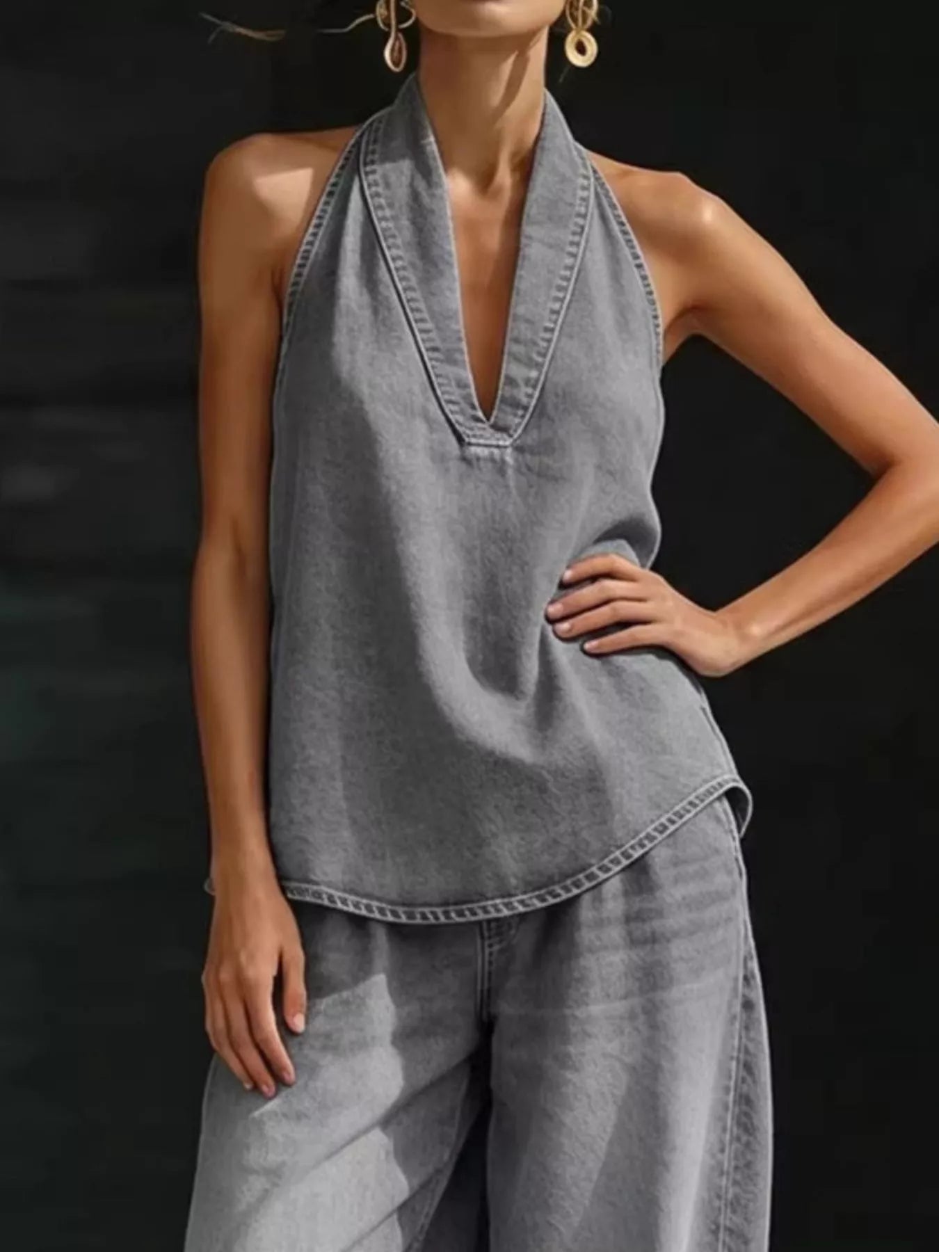 Plus size women's halter neck top and wide-leg pants two-piece set, trendy dress by Trendsi, shown on a model.