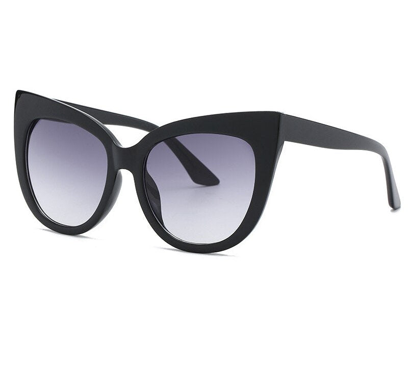 Women's oversized cat eye sunglasses from Plush Fashion Hub with UV400 protection, stylish black frames and tinted lenses.