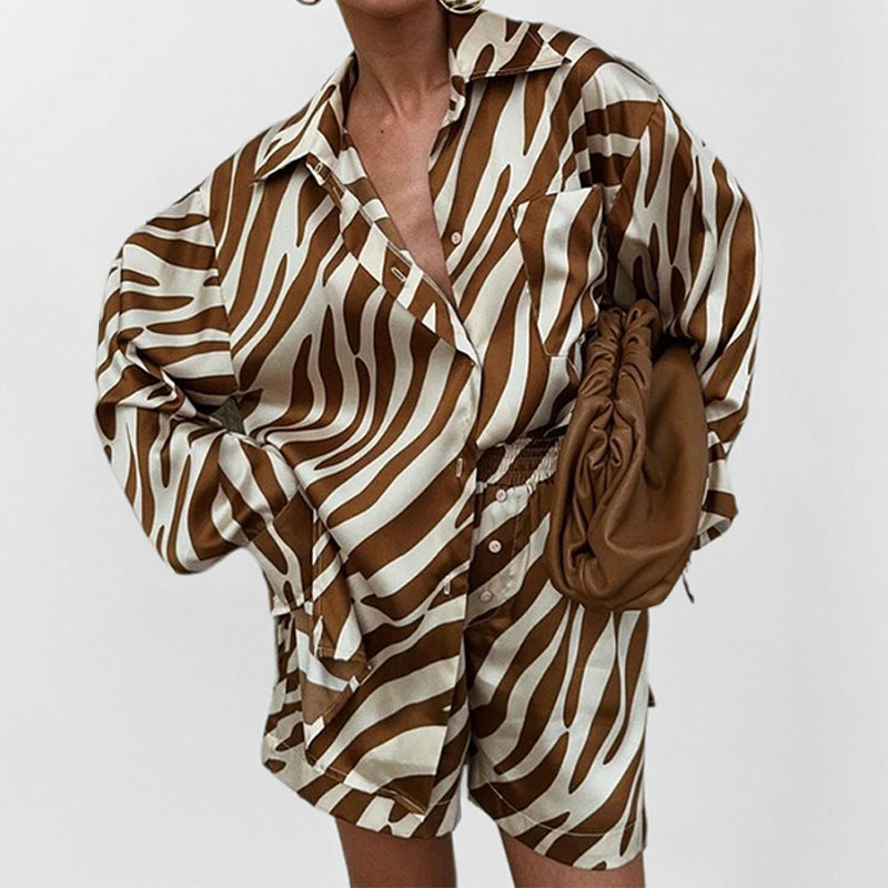 Printed short sleeve two-piece set from Plush Fashion Hub featuring a stylish top and matching bottoms.