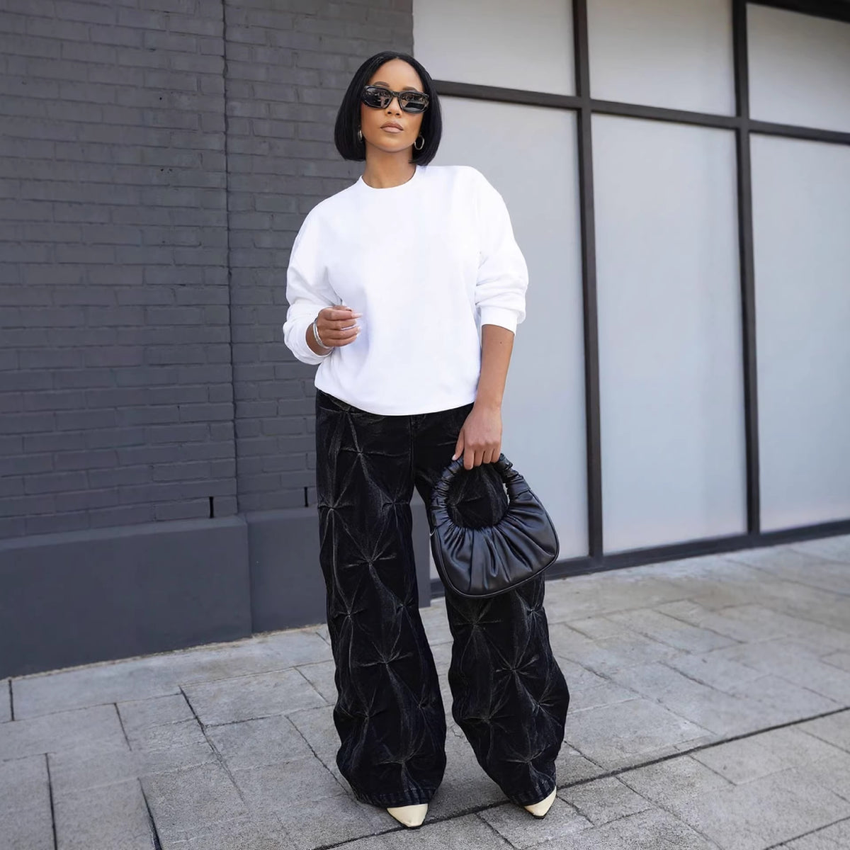 Eprolo street style dyed deconstructed pleated washed denim pants with a relaxed fit and unique distressed design.