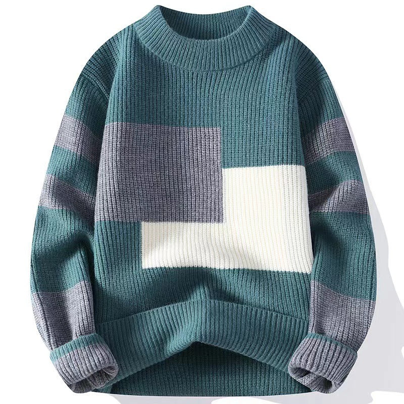 Teal knit sweater with grey and white colorblock design, long sleeves with stripes, and a ribbed crew neck.
