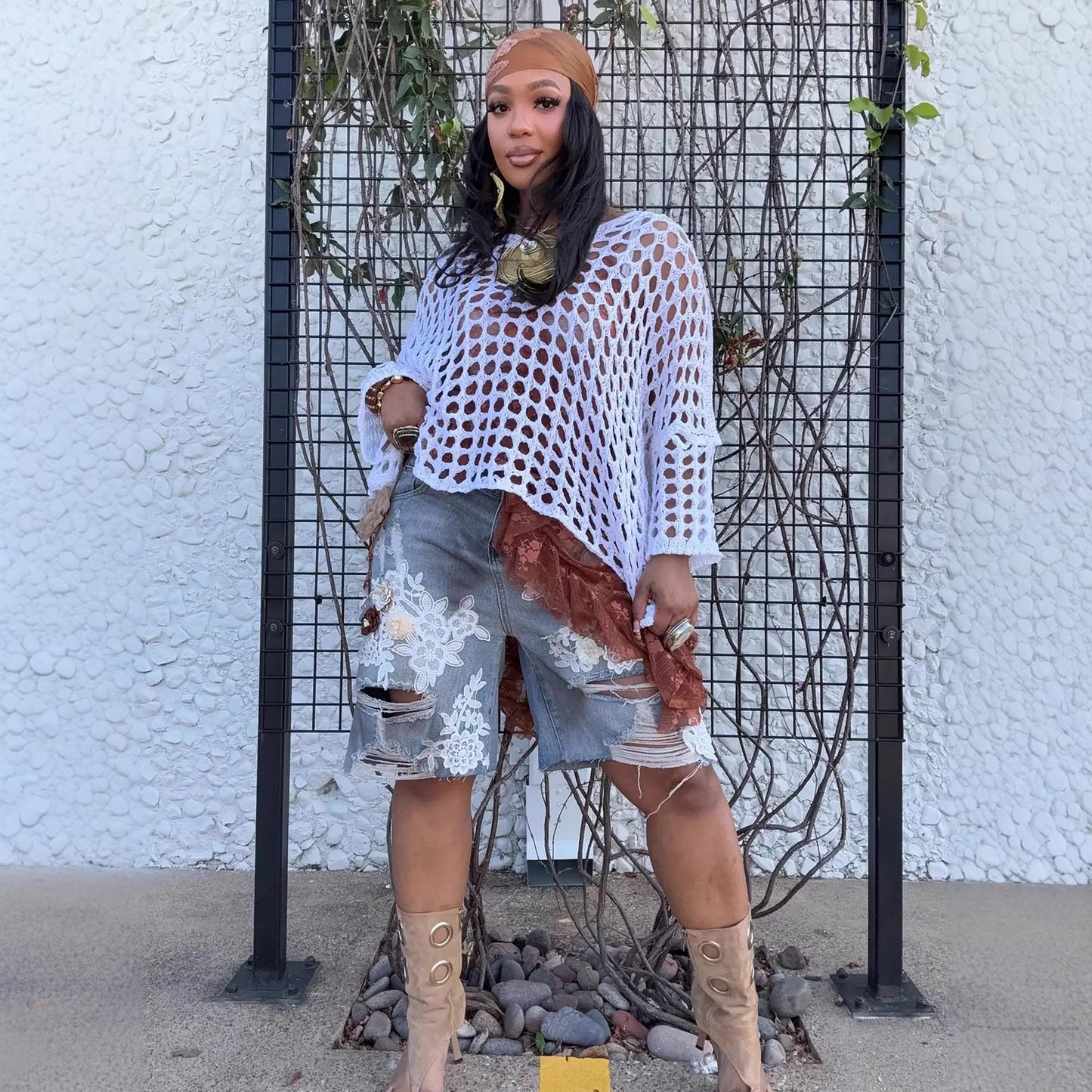 Distressed denim shorts with ripped details, lace hollow-out accents, and 3D floral embroidery from Plush Fashion Hub.