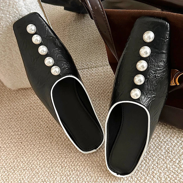 Beaded embellished Plush Fashion Hub slide sandals with plush straps and decorative beads on a white background.