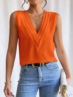 Women's sleeveless layered V-neck surplice tank top with pleated wrap-front in solid color, from Plush Fashion Hub.