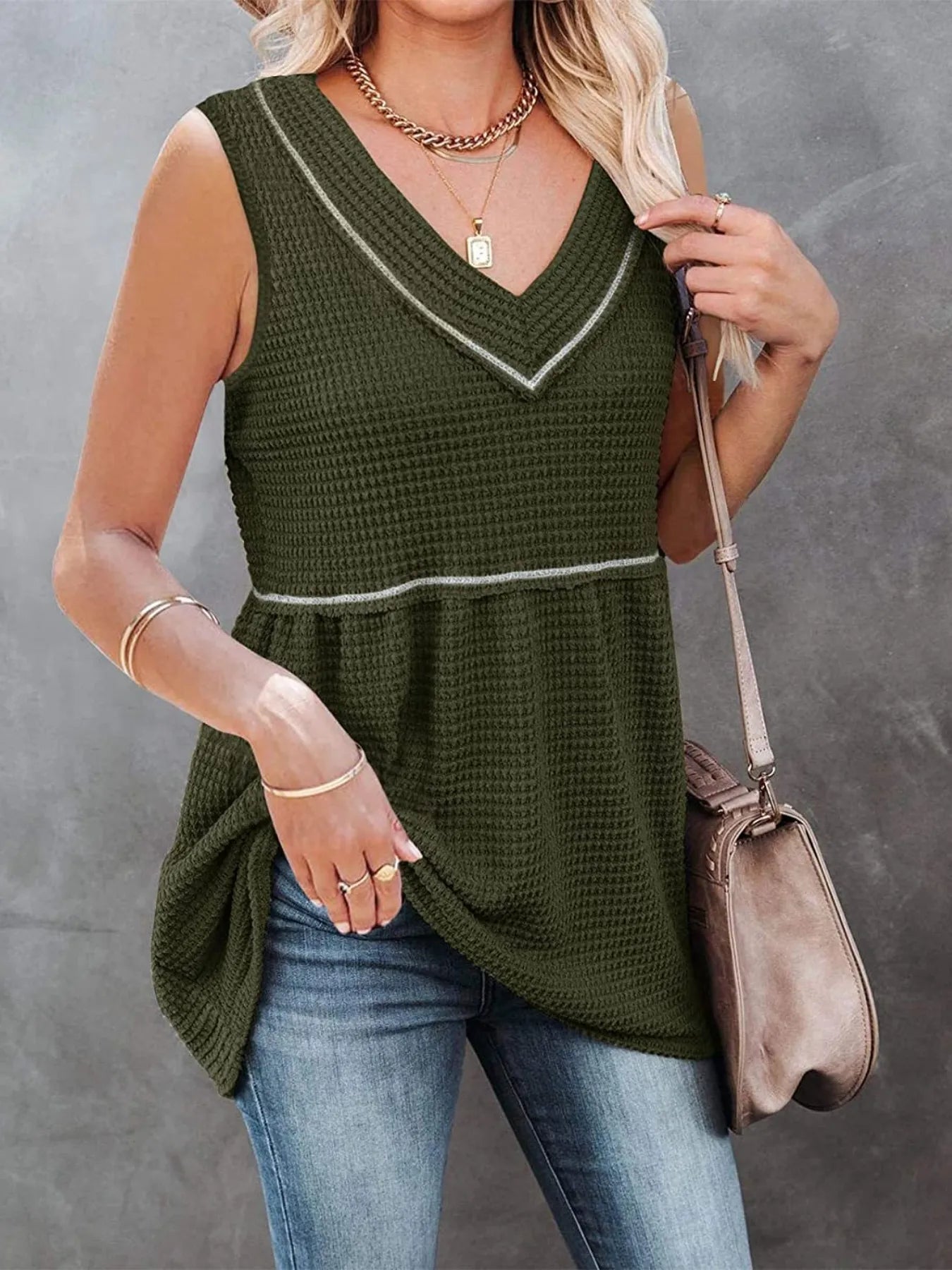 V-neck waffle knit tank top with contrast stitching, casual sleeveless top by Trendsi, shown in a close-up of fabric and stitching details.