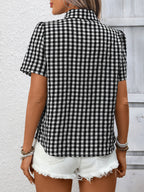 Women's lightweight plaid button-up short sleeve shirt by Trendsi shown in the image with a classic checkered pattern and collar.