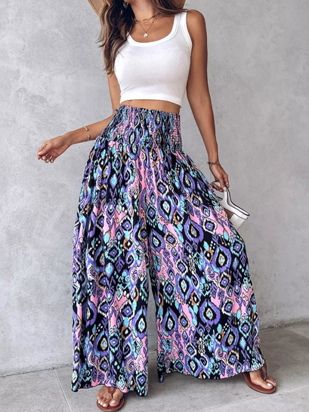 Printed wide-leg pants from Shopimist featuring a relaxed fit and bold floral pattern, displayed on a model.
