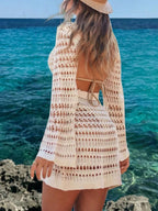 Women's long sleeve crochet knit beach cover-up dress by Trendsi, featuring boho style, lightweight fabric, and intricate crochet details.