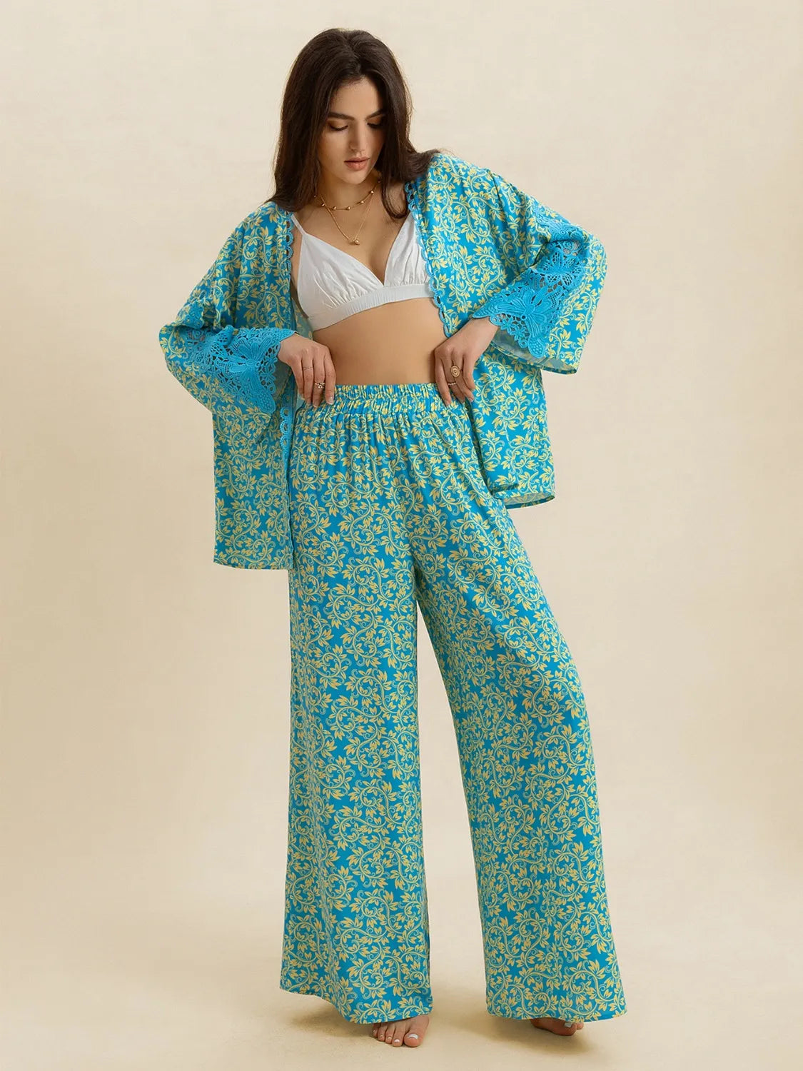Open front printed matching top and pants set by Plush Fashion Hub, featuring a stylish coordinated outfit with bold print details.