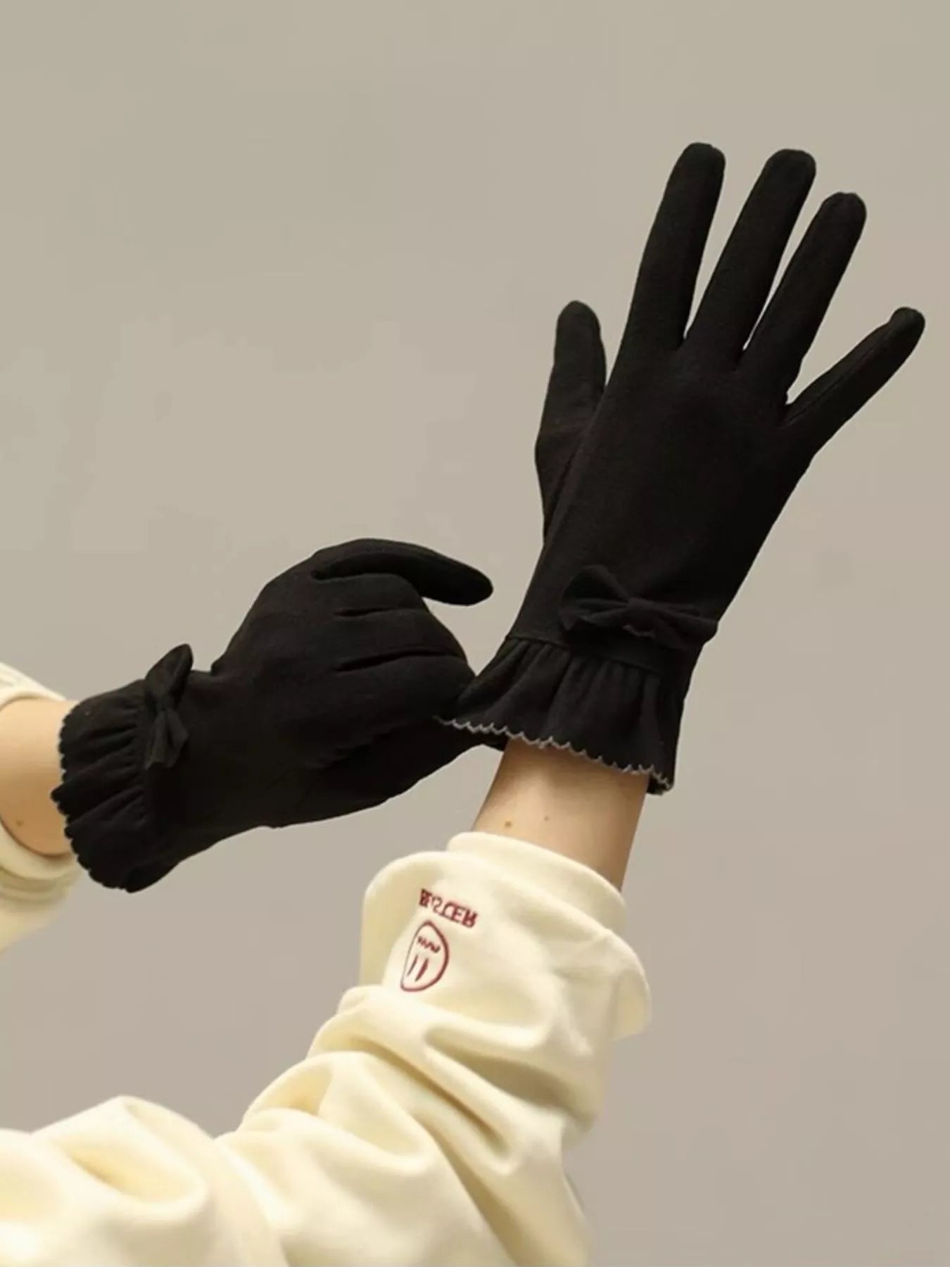Simply Love ruffled cuff bow gloves in soft fabric with decorative bows and ruffled cuffs, designed for elegant winter wear.