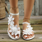 Floral embellished flat sandals by Shopimist featuring colorful flower accents and open toe design.