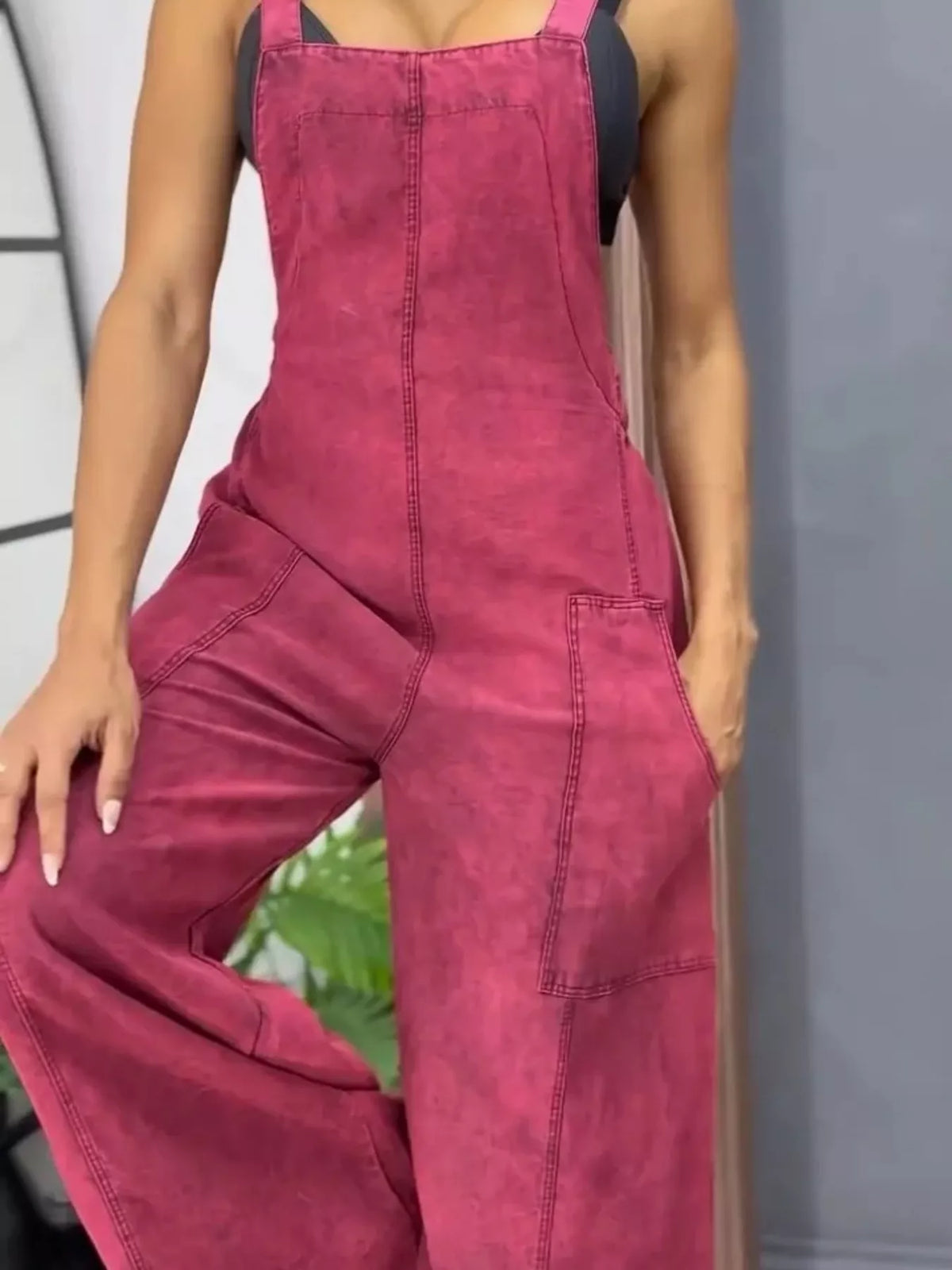 Blue wide-leg denim overalls by Plush Fashion Hub, full-size one-piece jumpsuit with relaxed fit and adjustable straps.