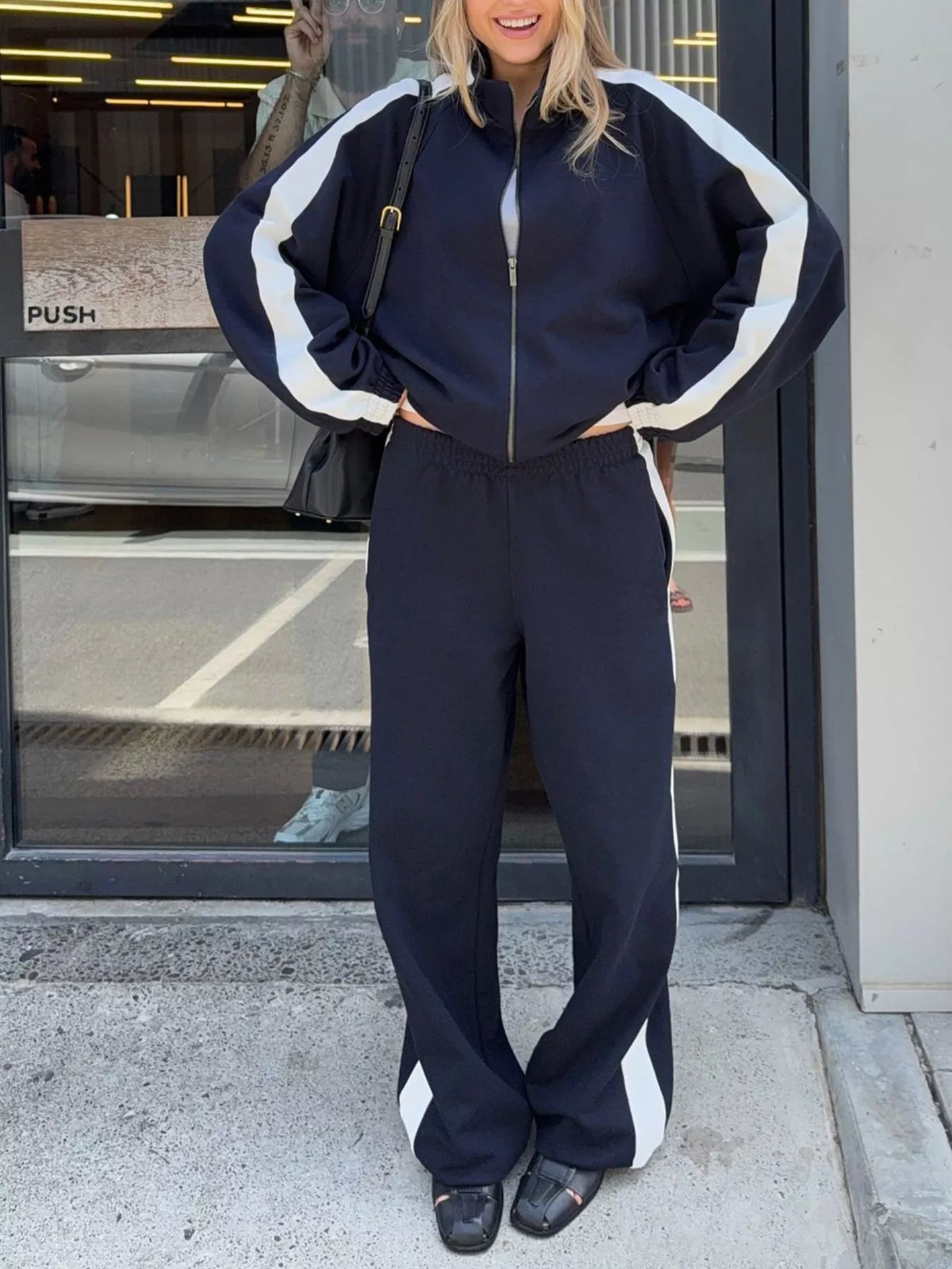 Plush Fashion Hub zip-up long sleeve tracksuit set with soft fabric, featuring a comfortable fit and stylish design.