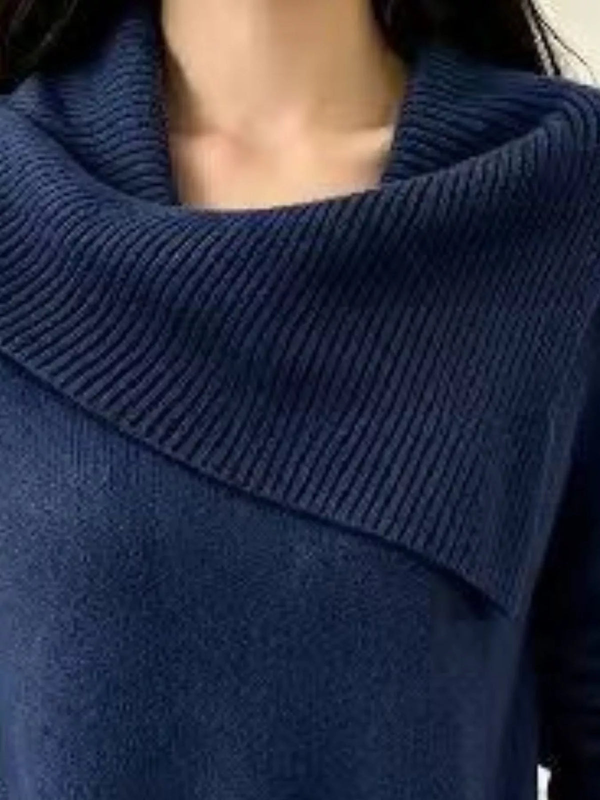 Plus size asymmetric ribbed collar sweater by Trendsi, featuring a cozy knit fabric and stylish design in natural setting.