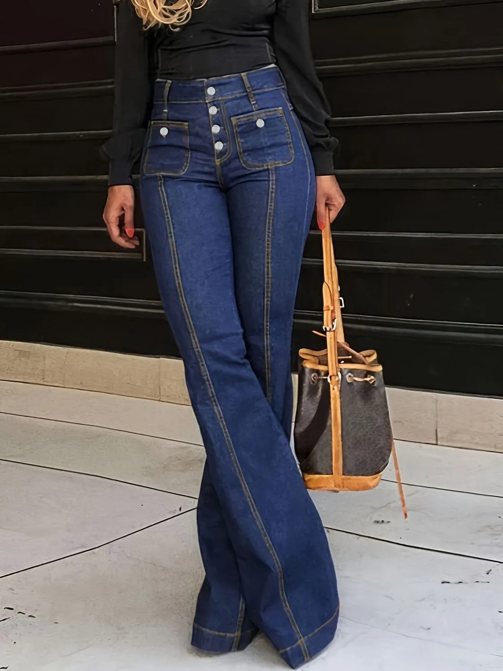 Plush Fashion Shop denim flare jeans with pockets, featuring a high-waisted style and wide-leg fit, visible on a model.