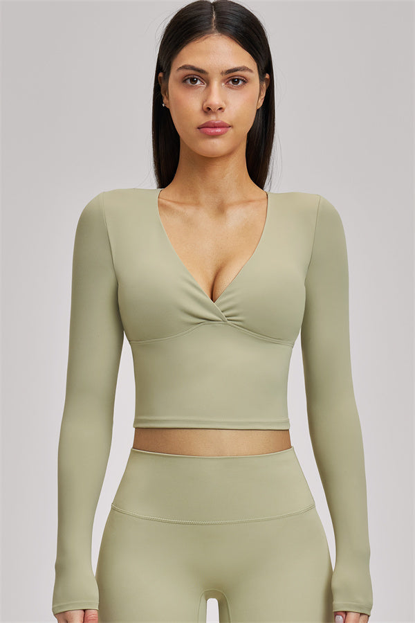 Fitglutes Activewear long sleeve crop top from The Swoon collection, stylish gymwear with a fitted design and long sleeves.