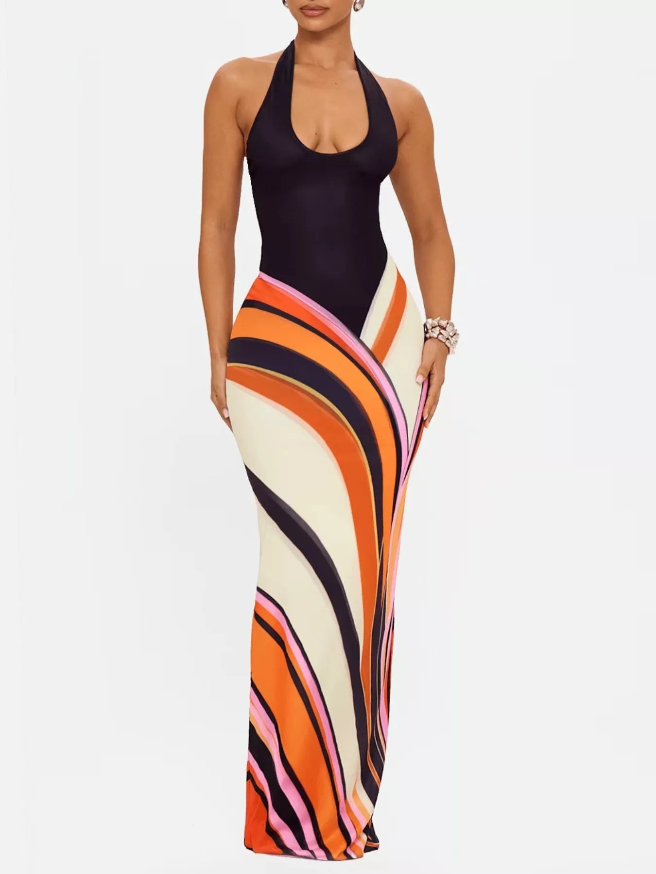 Abstract print halter neck maxi dress by Plush Fashion Hub, flowing fabric with vibrant patterns and a stylish halter neckline.