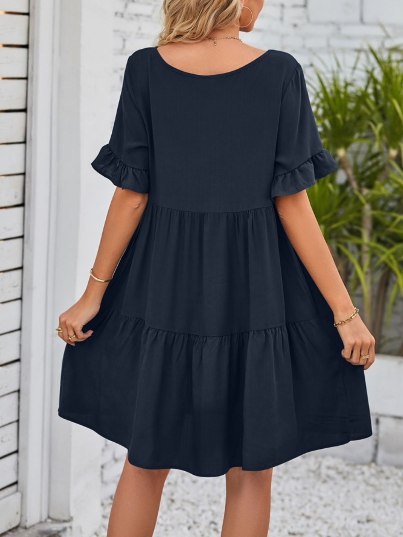 Lightweight rayon ruffled sleeve tiered mini dress with pockets from Trendsi, featuring a flowy silhouette and stylish design.