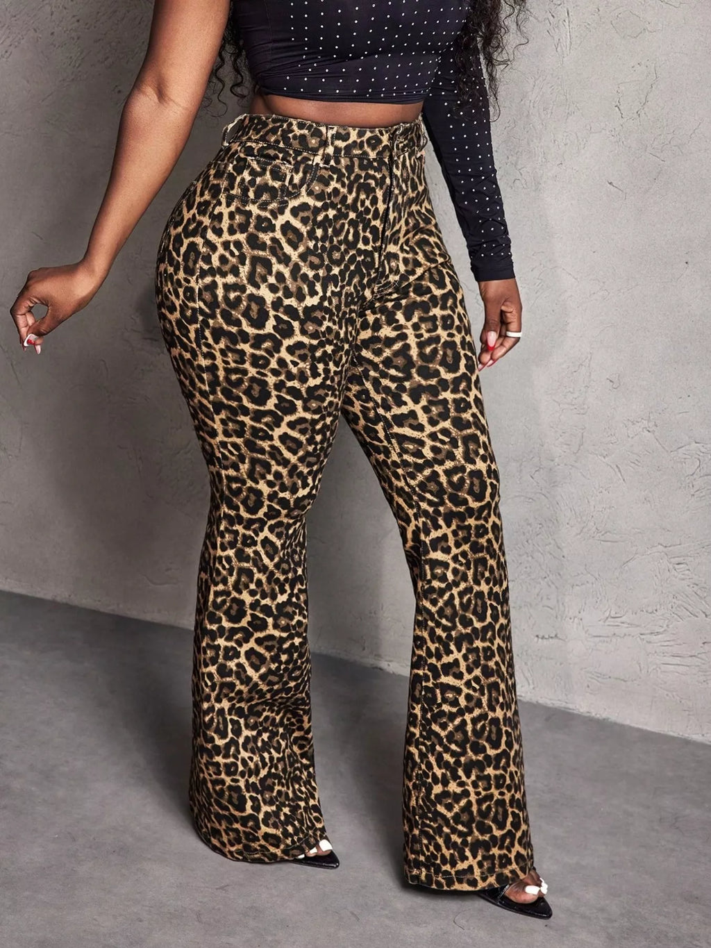 Leopard print wide-leg pants from Shopimist, featuring a relaxed fit and stylish design, displayed on a model.
