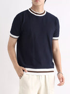Men's plus size contrast trim shorts sleeve T-shirt from Trendsi, featuring a casual fit and stylish color contrast trim.