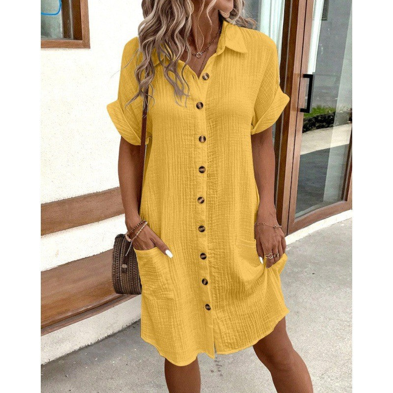 Women's FitiqueFit V-neck button-front A-line shirt dress hanging on a wooden hanger, showing its classic design and soft fabric.